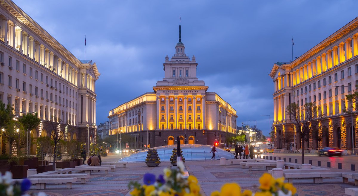 Sofia’s Independence Square and the former Party House lit up at dusk